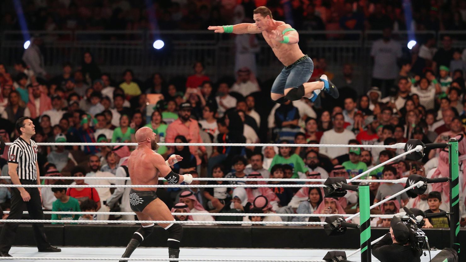WWE Superstars John Cena (R) and Triple H.