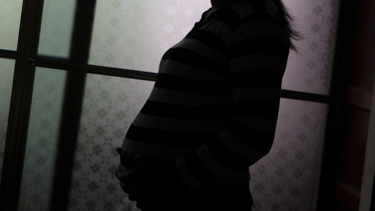 Lu Libing's wife, Mu, poses for pictures during an interview with Reuters at their home in Ganzhou, Jiangxi province March 13, 2014. Lu knew he had only one choice as the birth of his third child approached. He couldn't afford hefty fines that would be meted out by Chinese authorities, so he put the unborn child up for adoption. On the Internet he found "A Home Where Dreams Come True", a website touted as China's biggest online adoption forum, part of an industry that has been largely unregulated for years. Demand for such websites has been fuelled by rural poverty, China's one-child policy, limiting most couples of only one child, and desperate, childless couples. To match story CHINA-ADOPTIONS/ Picture taken March 13. REUTERS/Alex Lee (CHINA - Tags: SOCIETY POVERTY)