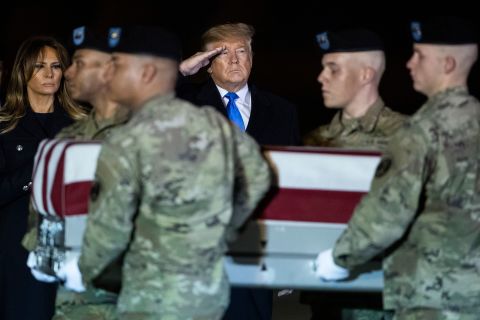 Trump and the first lady watch as a US Army carry team moves a transfer case containing the remains of Chief Warrant Officer 2 David C. Knadle in November 2019. Knadle, 33, was killed in a helicopter crash while serving in Afghanistan.