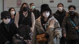 BEIJING, CHINA - JANUARY 30: Passengers wear protective masks as they arrive at Beijing Capital Airport on January 30, 2020 in Beijing, China. The number of cases of a deadly new coronavirus rose to over 7000 in mainland China Thursday as the country continued to lock down the city of Wuhan in an effort to contain the spread of the pneumonia-like disease which medicals experts have confirmed can be passed from human to human. In an unprecedented move, Chinese authorities put travel restrictions on the city which is the epicentre of the virus and neighbouring municipalities affecting tens of millions of people. The number of those who have died from the virus in China climbed to over 170 on Thursday, mostly in Hubei province, and cases have been reported in other countries including the United States, Canada, Australia, Japan, South Korea, and France. The World Health Organization  has warned all governments to be on alert, and its emergency committee is to meet later on Thursday to decide whether to declare a global health emergency. (Photo by Kevin Frayer/Getty Images)