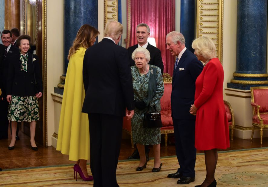 The Trumps greet Britain's Queen Elizabeth II during a NATO reception held at Buckingham Palace in December 2019.