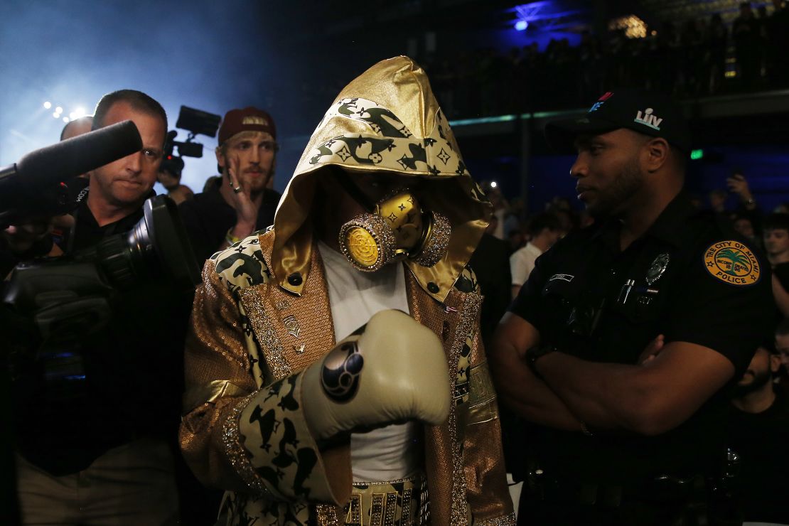 Jake Paul entered the ring wearing a custom Louis Vuitton-branded robe and gas mask.