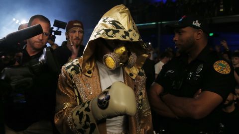 Jake Paul entered the ring wearing a custom Louis Vuitton-branded robe and gas mask.