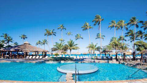 Get four nights with an IHG Premier card and redeem your points at hotels like the Holiday Inn Resort Aruba-Beach.