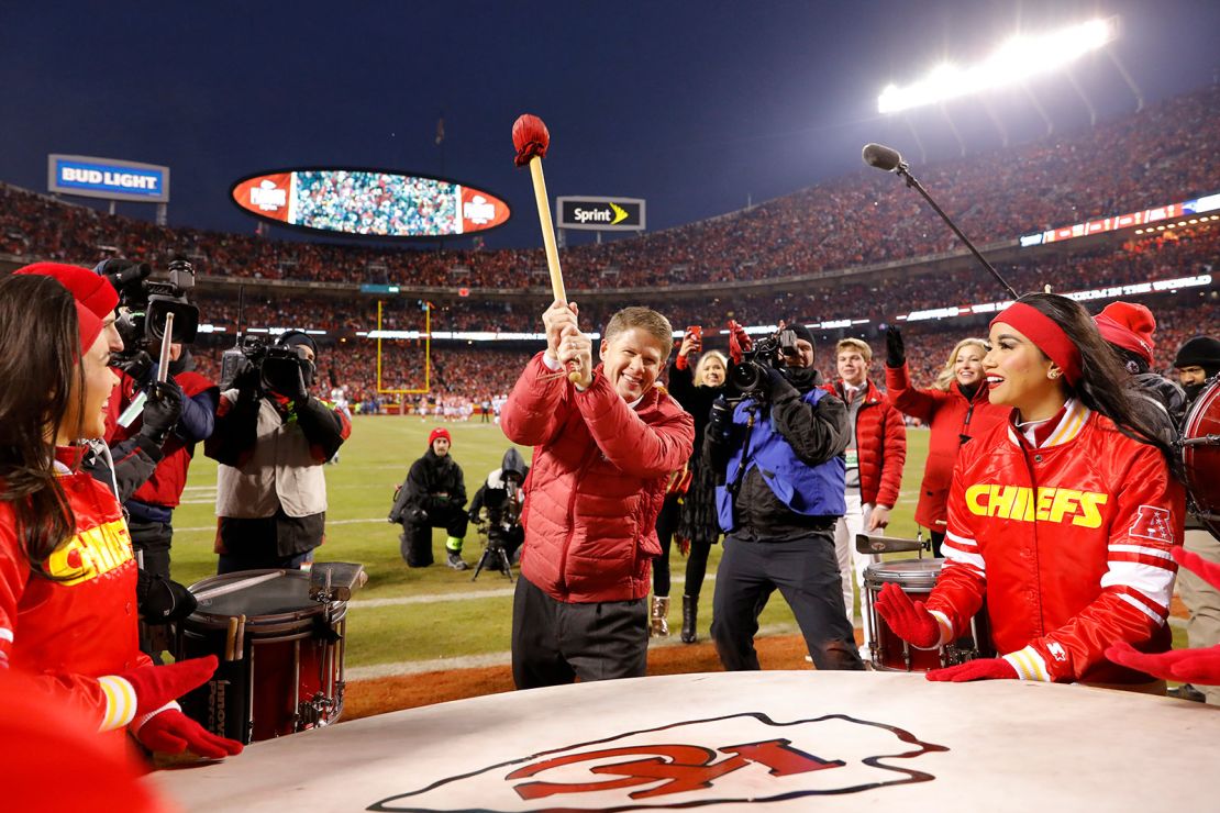 Kansas City Chiefs owner Clark Hunt bangs the drum before a game. Drums are important parts of Native culture.