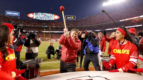 Kansas City Chiefs owner Clark Hunt bangs the drum before a game. Drums are important parts of Native culture.
