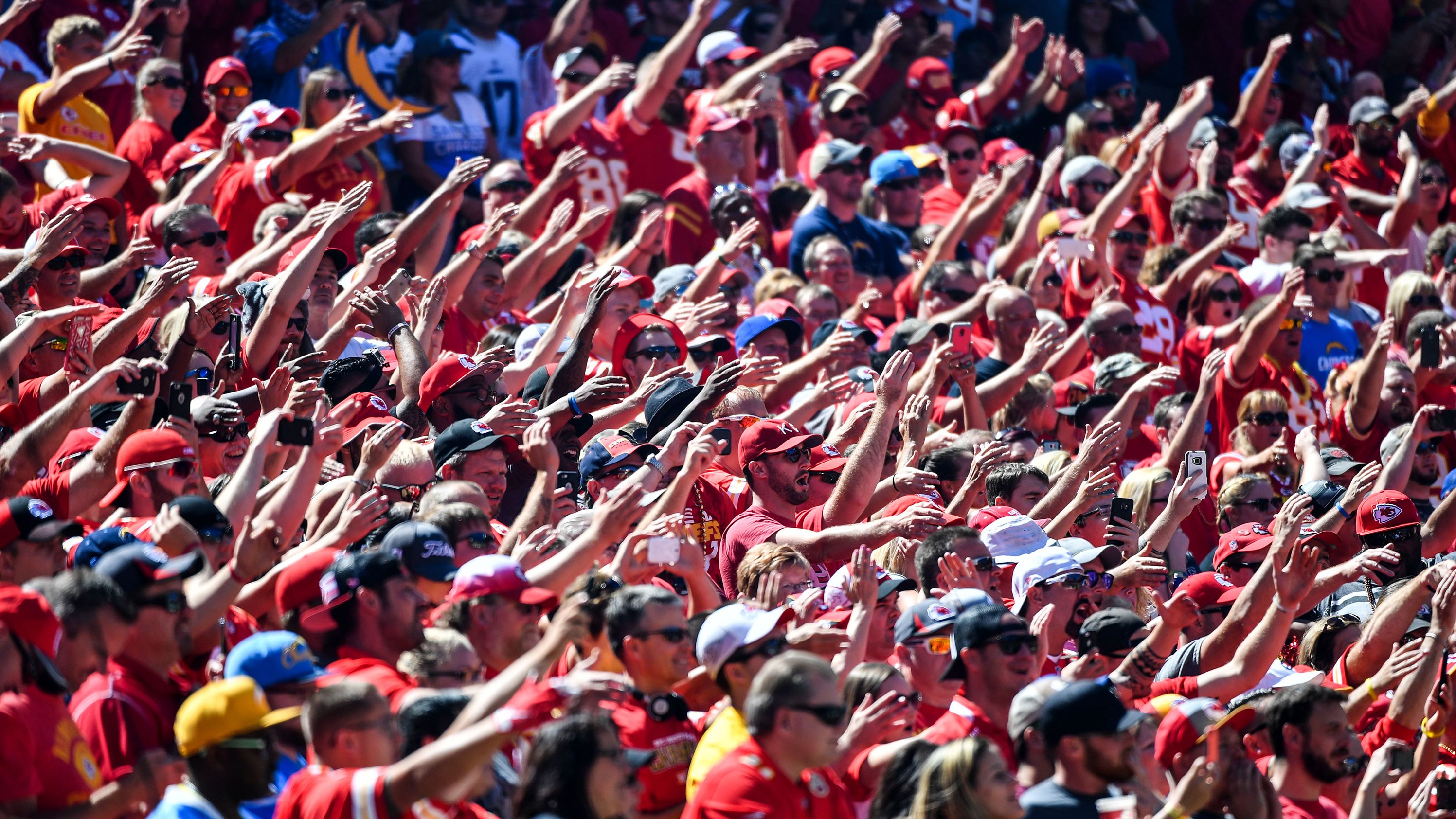 Kansas City Chiefs fans do the tomahawk chop before a game against the San Diego Chargers.