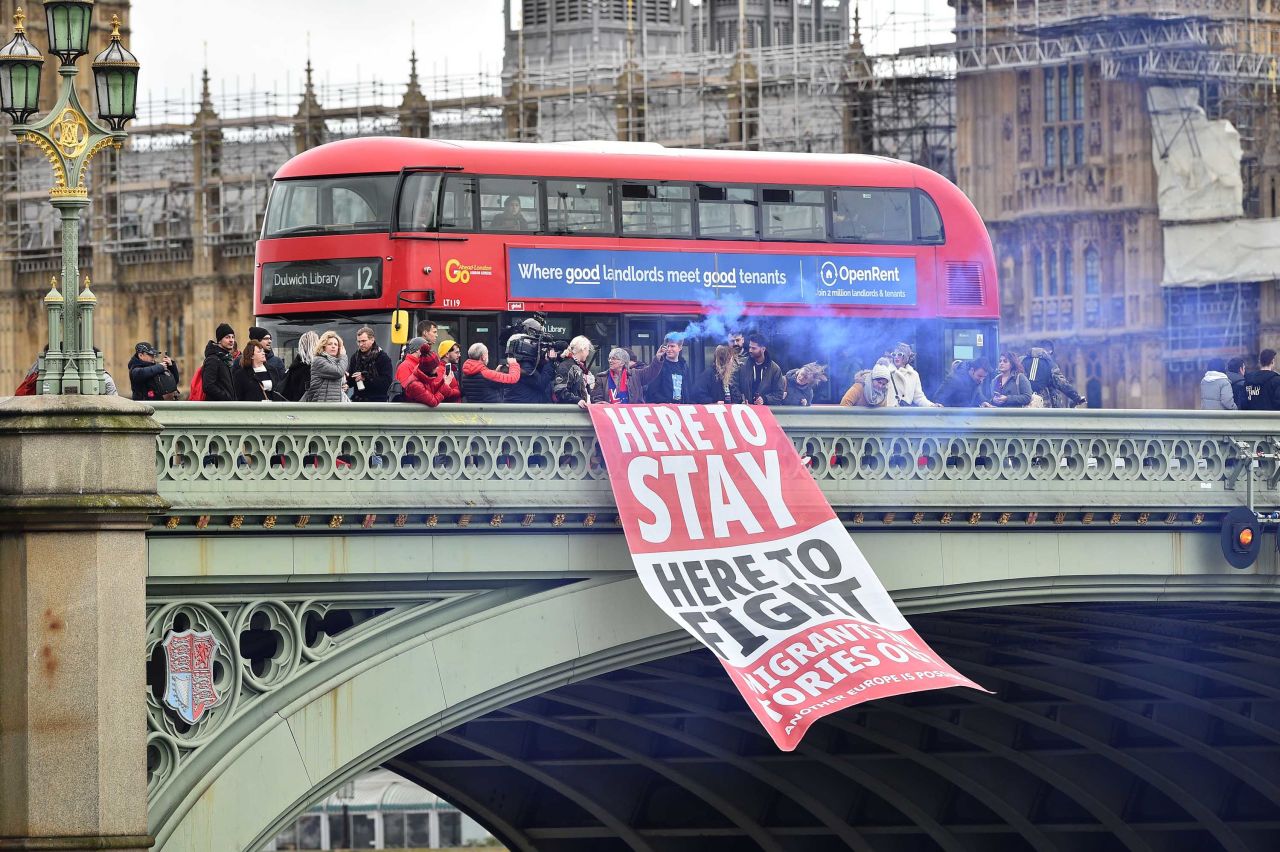 Anti-Brexit protesters hold up a banner on London's Westminster Bridge.