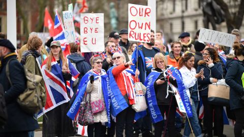 Pro-Brexit supporters wave placards at Parliament Square as people prepare for Brexit on January 31.