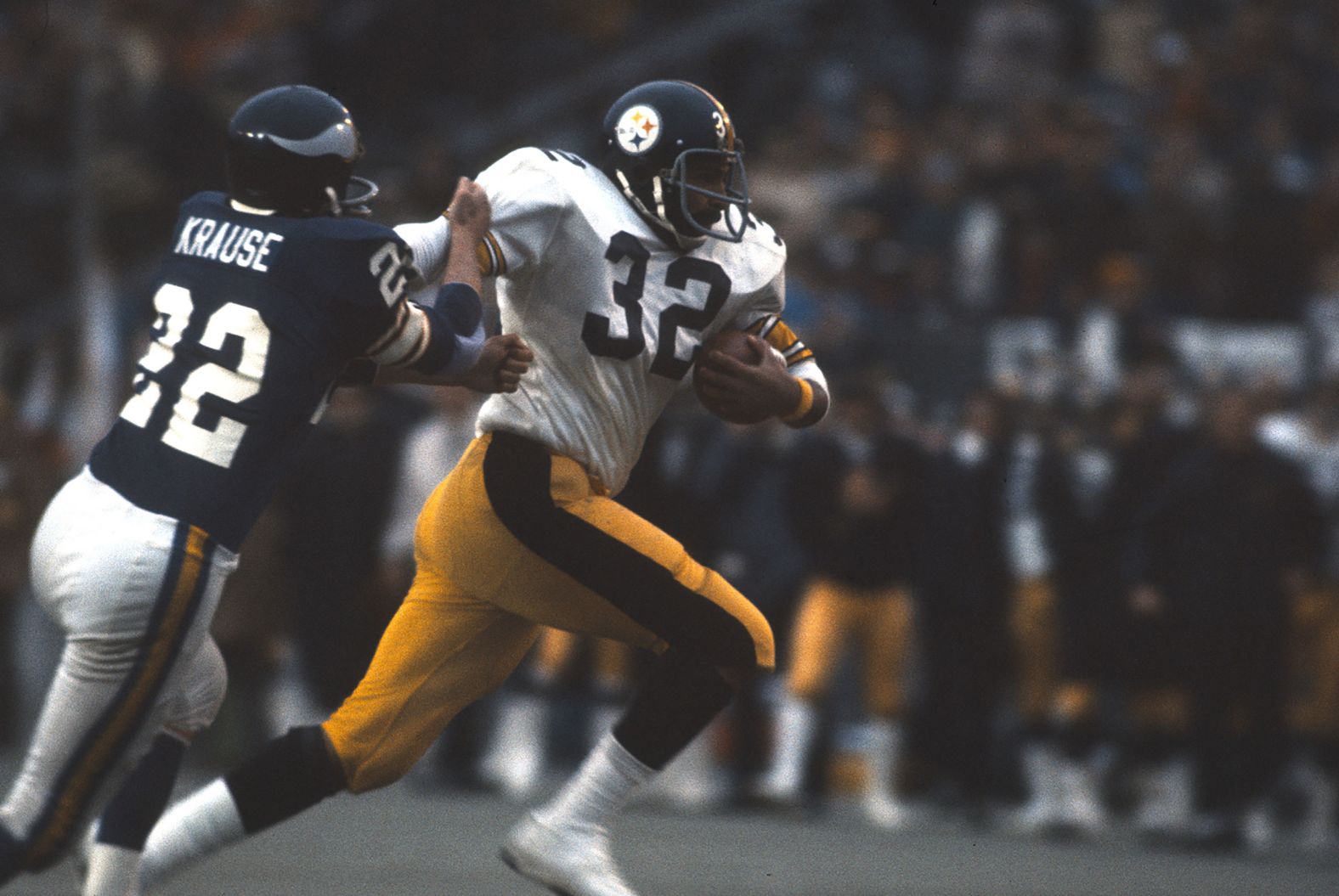 <strong>Super Bowl IX (1975):</strong> Pittsburgh Steelers running back Franco Harris fights off Minnesota defender Paul Krause during Pittsburgh's 16-6 victory in Super Bowl IX. Harris ran for 158 yards and a touchdown on his way to winning MVP.