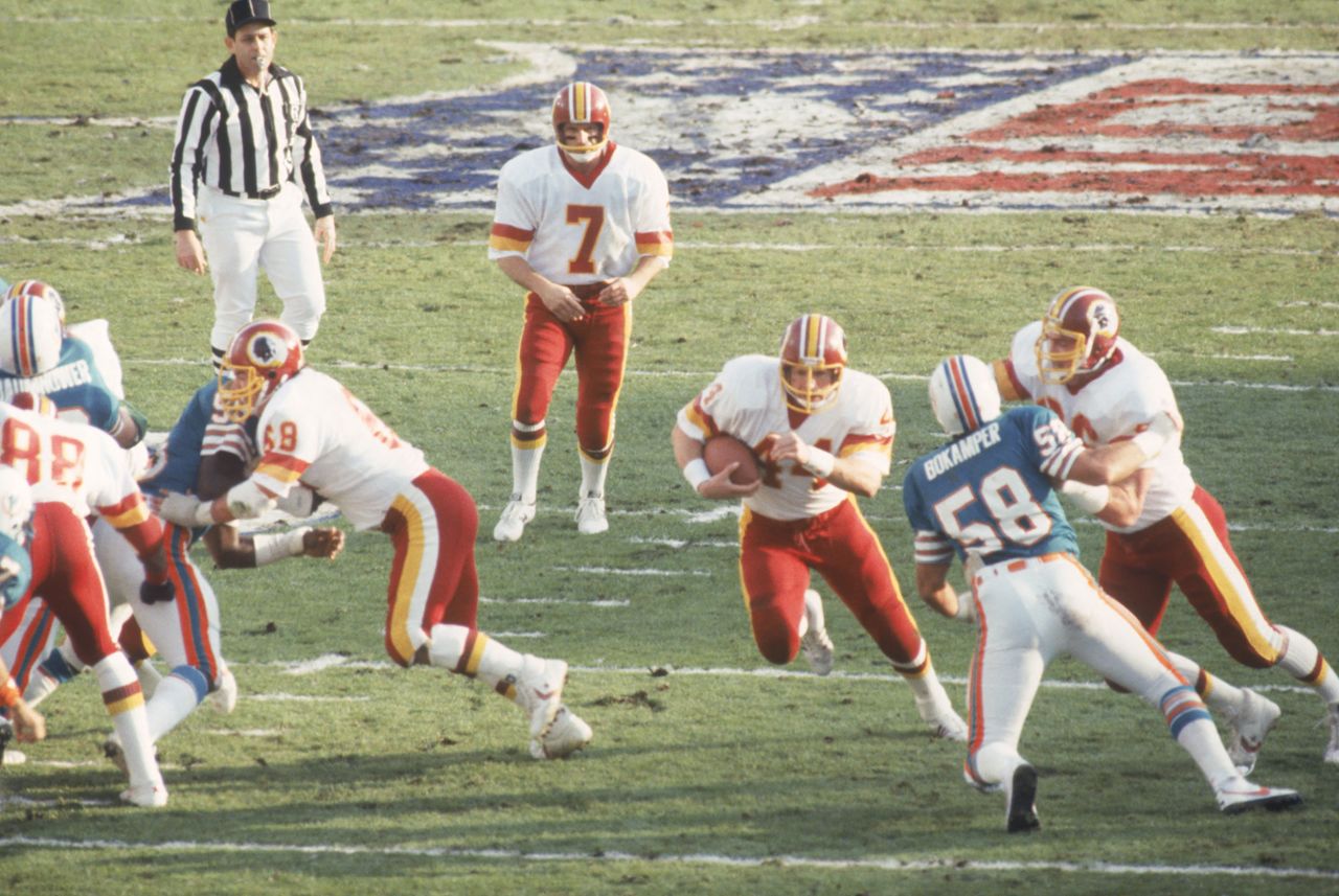 <strong>Super Bowl XVII (1983):</strong> Washington running back John Riggins bursts through a hole during the Redskins' 27-17 victory over Miami in Super Bowl XVII. Riggins was named MVP after rushing for 166 yards and a touchdown.