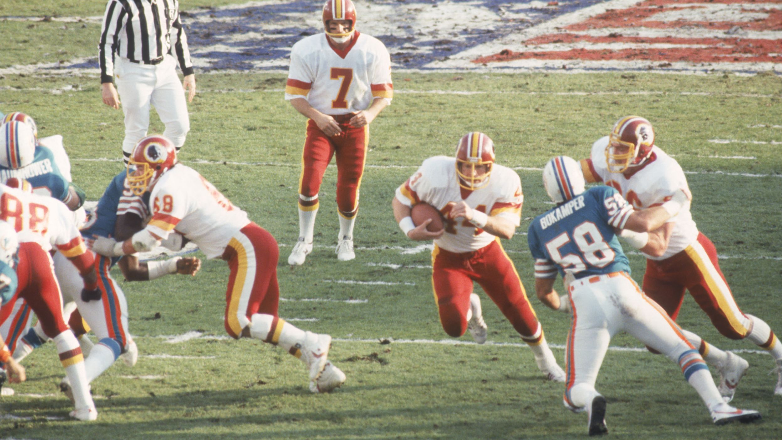 <strong>Super Bowl XVII (1983):</strong> Washington running back John Riggins bursts through a hole during the Redskins' 27-17 victory over Miami in Super Bowl XVII. Riggins was named MVP after rushing for 166 yards and a touchdown.