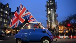 A man waves Union flags from a small car as he drives past Brexit supporters gathering in Parliament Square, near the Houses of Parliament in central London on January 31, 2020 on the day that the UK formally leaves the European Union. - Britain on January 31 ends almost half a century of integration with its closest neighbours and leaves the European Union, starting a new -- but still uncertain -- chapter in its long history. (Photo by DANIEL LEAL-OLIVAS / AFP) (Photo by DANIEL LEAL-OLIVAS/AFP via Getty Images)