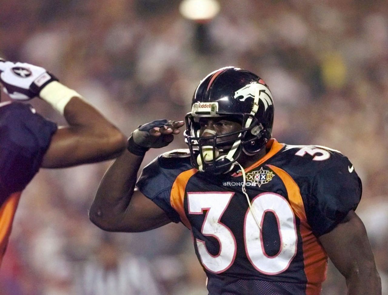 <strong>Super Bowl XXXII (1998):</strong> Denver Broncos running back Terrell Davis does his signature "Mile High Salute" after scoring a touchdown against Green Bay in Super Bowl XXXII. Davis rushed for 157 yards and three touchdowns on his way to winning MVP.