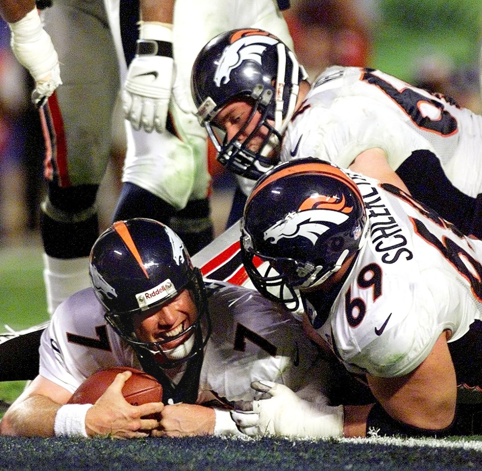 <strong>Super Bowl XXXIII (1999):</strong> Denver quarterback John Elway smiles after scoring a touchdown in Super Bowl XXXIII. Elway was named MVP of the game, throwing for 336 yards as the Broncos won back-to-back titles with a 34-19 victory over Atlanta. It was Elway's last game before he retired.
