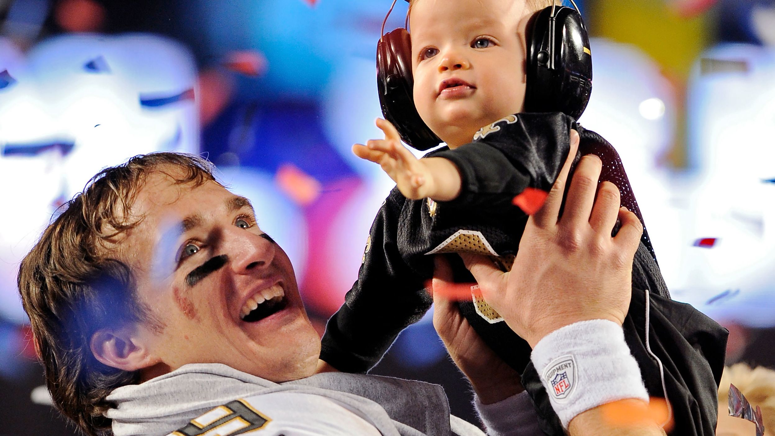 <strong>Super Bowl XLIV (2010):</strong> New Orleans Saints quarterback Drew Brees raises his son Baylen after the Saints beat Indianapolis 31-17 in Super Bowl XLIV. Brees completed 32 of 39 passes for 288 yards and two touchdowns.