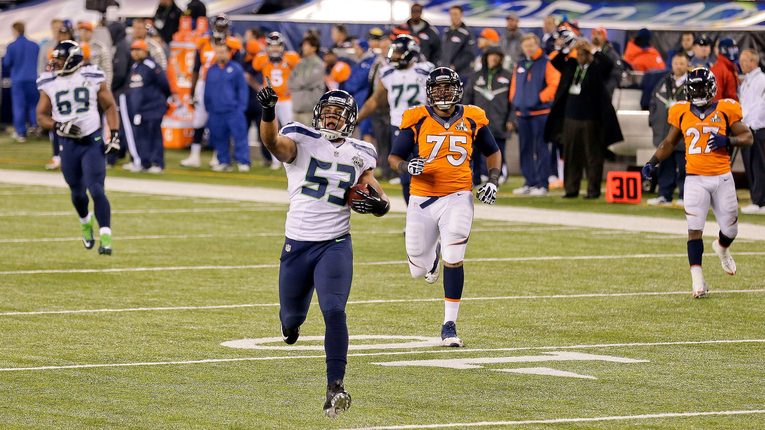 <strong>Super Bowl XLVIII (2014):</strong> Seattle Seahawks linebacker Malcolm Smith runs an interception back for a touchdown during Seattle's 43-8 drubbing of Denver in Super Bowl XLVIII. Smith and Seattle's "Legion of Boom" defense stifled Peyton Manning and Denver's No. 1-rated offense.