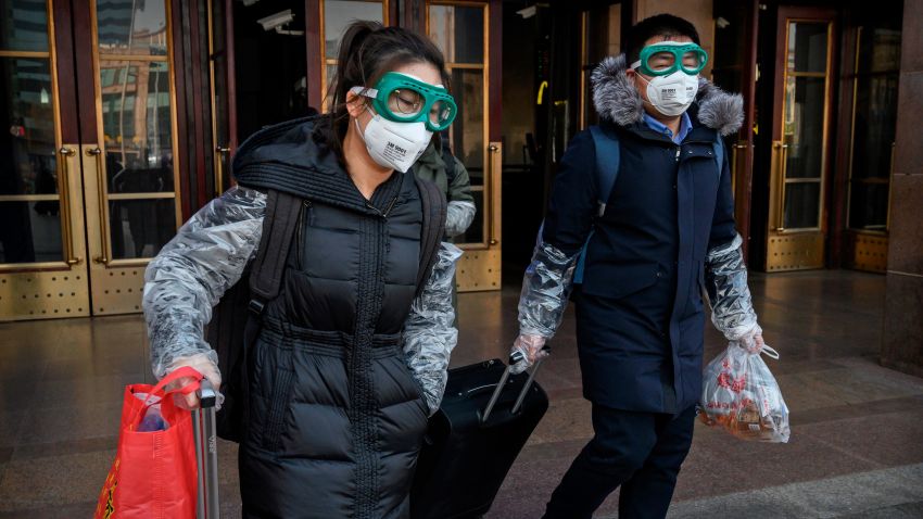 BEIJING, CHINA - JANUARY 31: A Chinese couple wear protective masks and goggles after getting off a train as they and others return after the Spring Festival holiday on January 31, 2020 in Beijing, China. The number of cases of a deadly new coronavirus rose to almost 9700 in mainland China Friday, the day after the World Health Organization (WHO) declared the outbreak a global public health emergency. China continued to lock down the city of Wuhan in an effort to contain the spread of the pneumonia-like disease which medical experts have confirmed can be passed from human to human. In an unprecedented move, Chinese authorities have put travel restrictions on the city which is the epicentre of the virus and neighbouring municipalities affecting tens of millions of people. The number of those who have died from the virus in China climbed to over 213 on Friday, mostly in Hubei province, and cases have been reported in other countries including the United States, Canada, Australia, Japan, South Korea, India, the United Kingdom, Germany, France and several others. The World Health Organization has warned all governments to be on alert and screening has been stepped up at airports around the world. (Photo by Kevin Frayer/Getty Images)