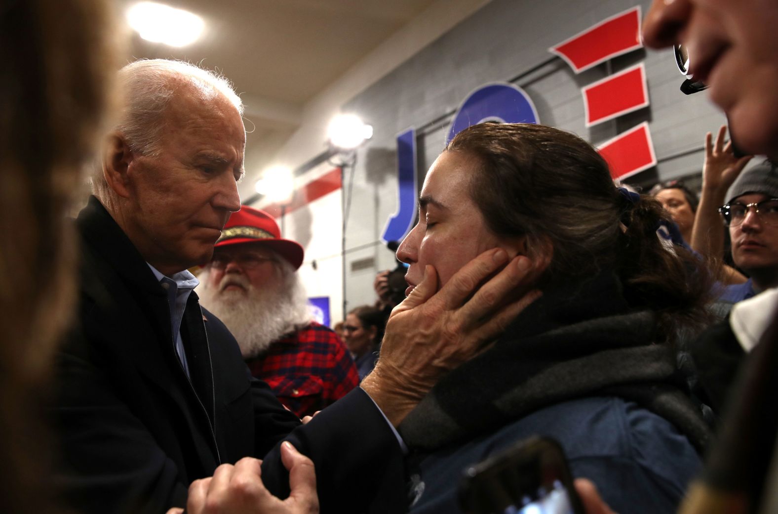 Biden greets a voter in Cedar Rapids on February 1.