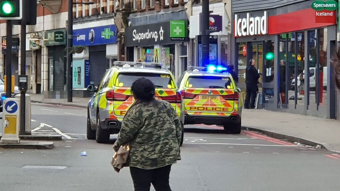 An image from the scene shows where a man was shot by armed officers in Streatham. Because of the graphic nature of the scene, CNN has blurred the body of the suspect.