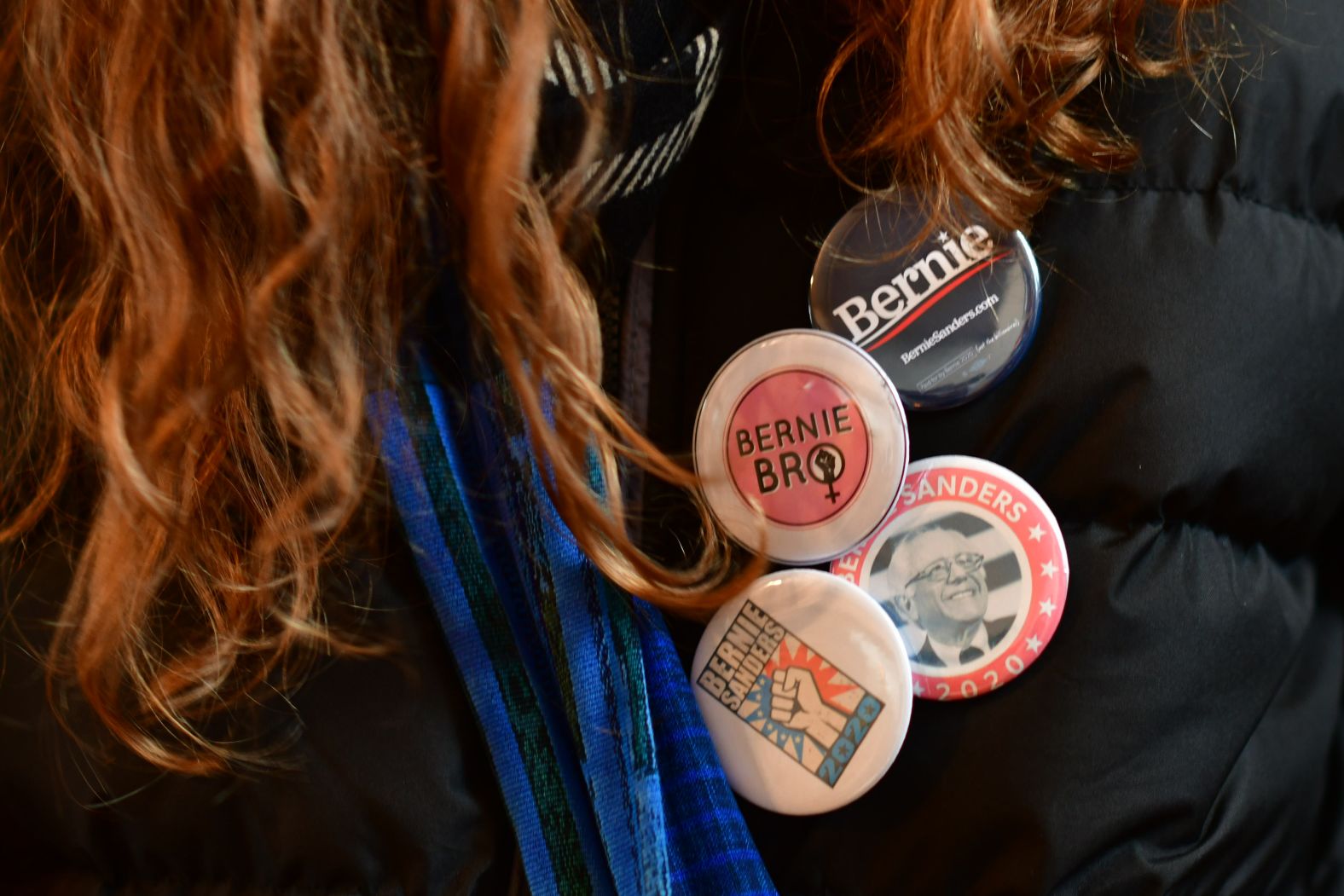 A volunteer wears Sanders campaign pins during an event in Waterloo on February 1.
