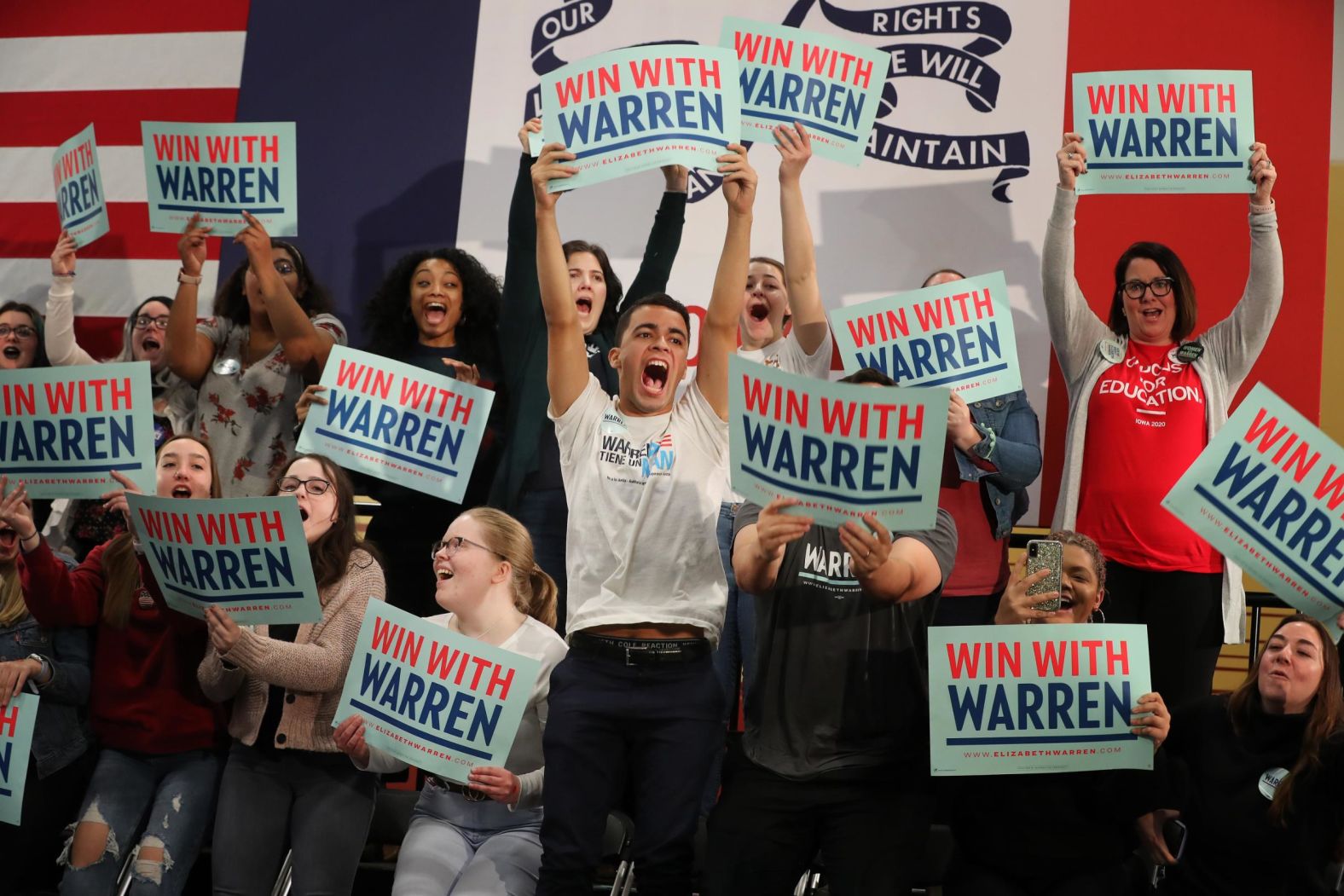 Warren supporters cheer during a campaign rally in Cedar Rapids on February 1.