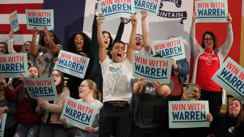 Warren supporters cheer during a campaign rally in Cedar Rapids on February 1.