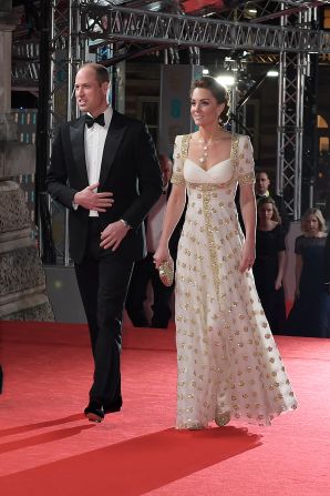 Prince William, Duke of Cambridge, and Catherine, Duchess of Cambridge, in an Alexander McQueen dress she first wore in 2012. Scroll through the gallery for more of the night's best fashion.