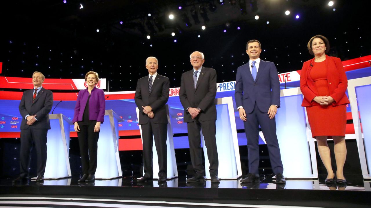 DES MOINES, IOWA - JANUARY 14:  Tom Steyer (L-R), Sen. Elizabeth Warren (D-MA), former Vice President Joe Biden, Sen. Bernie Sanders (I-VT), former South Bend, Indiana Mayor Pete Buttigieg, and Sen. Amy Klobuchar (D-MN) await the start of the Democratic presidential primary debate at Drake University on January 14, 2020 in Des Moines, Iowa.  Six candidates out of the field qualified for the first Democratic presidential primary debate of 2020, hosted by CNN and the Des Moines Register.  (Photo by Spencer Platt/Getty Images)