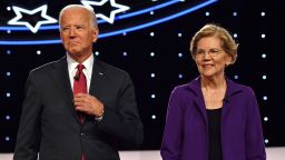 Democratic presidential hopefuls Former Vice President Joe Biden (L) and Massachusetts Senator Elizabeth Warren arrive onstage for the fourth Democratic primary debate of the 2020 presidential campaign season co-hosted by The New York Times and CNN at Otterbein University in Westerville, Ohio on October 15, 2019. (Photo by Nicholas Kamm / AFP) (Photo by NICHOLAS KAMM/AFP via Getty Images)