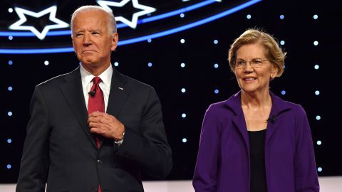 Biden and Warren arrive onstage for the fourth Democratic primary debate of the 2020 presidential campaign season co-hosted by The New York Times and CNN at Otterbein University in Westerville, Ohio on October 15, 2019. 