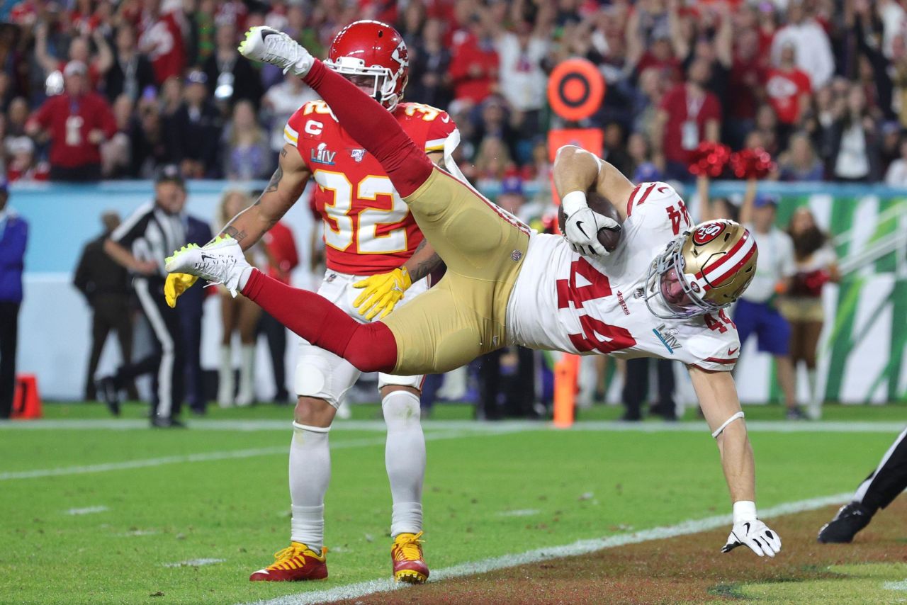 San Francisco's Kyle Juszczyk leaps into the end zone to score a touchdown in the second quarter. The game was tied 10-10 at halftime.