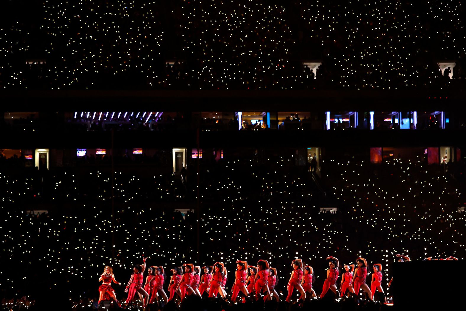Shakira, left, with dancers.