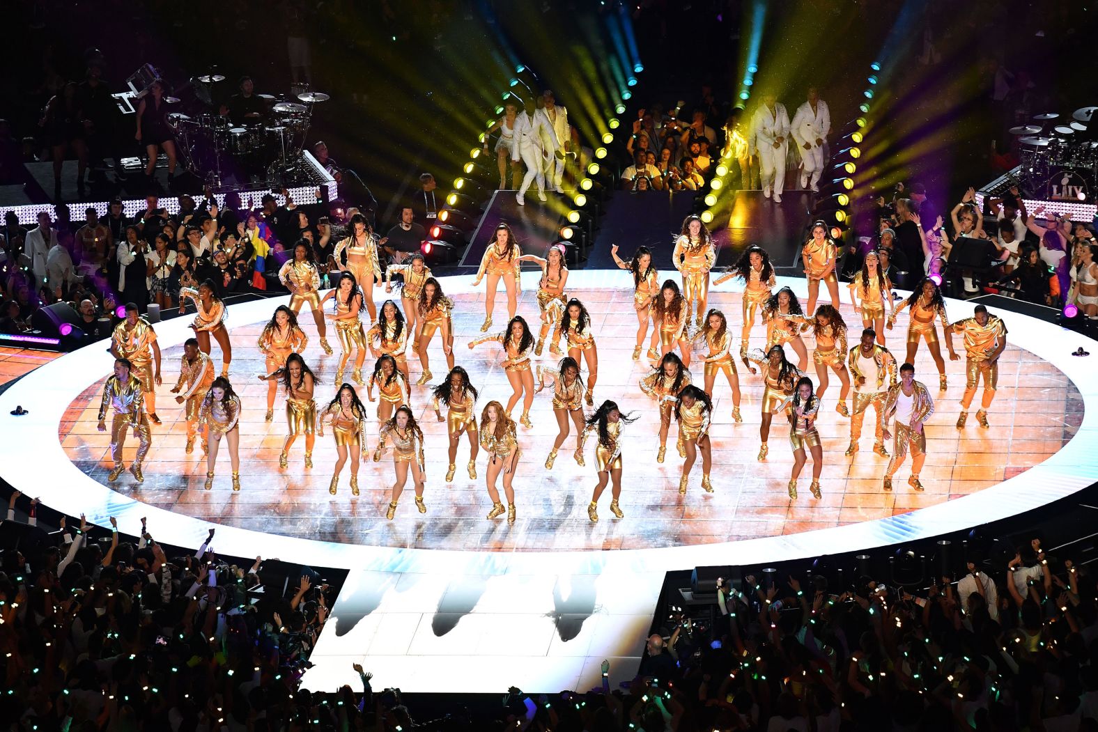 Shakira and dancers appear on stage.