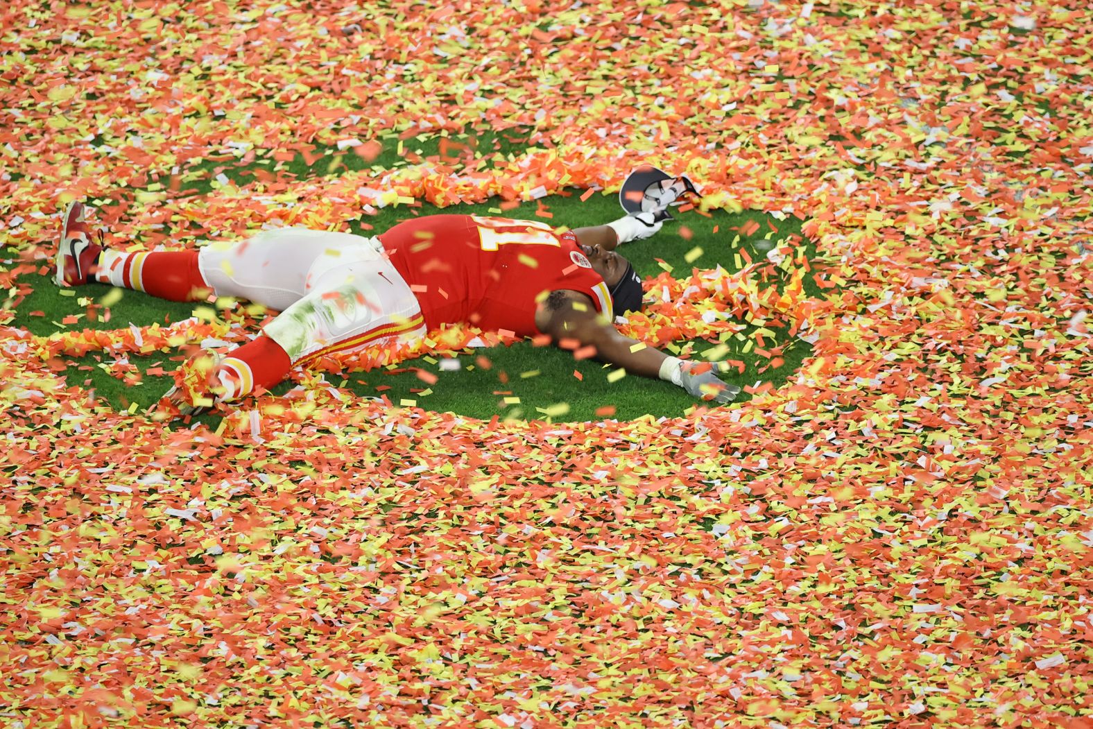 Kansas City's Derrick Nnadi makes a confetti angel after the game.