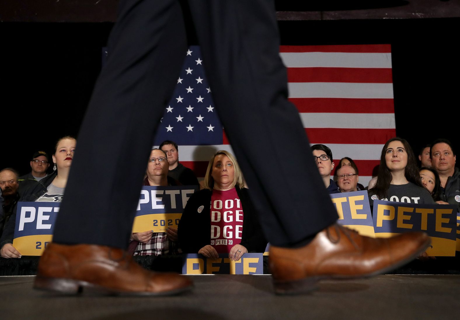 Audience members listen to Buttigieg at a rally in Waterloo, Iowa, on Saturday, February 1.