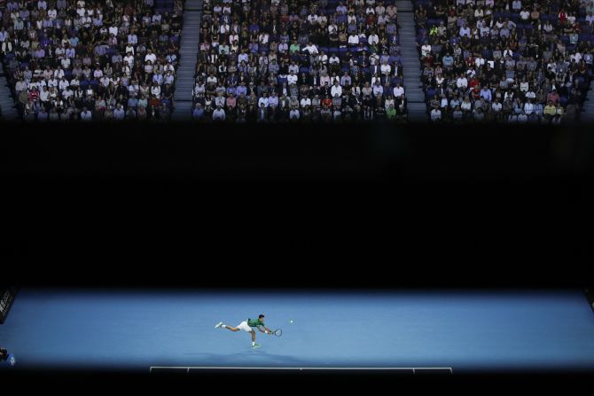 Novak Djokovic returns a shot during the Australian Open final on Sunday, February 2. <a href="index.php?page=&url=https%3A%2F%2Fwww.cnn.com%2F2020%2F02%2F02%2Ftennis%2Fdjokovic-thiem-australian-open-final-spt-intl%2Findex.html" target="_blank">Djokovic defeated Dominic Thiem</a> in a five-set match that went nearly four hours. It is his eighth Australian Open title and his 17th grand slam overall.