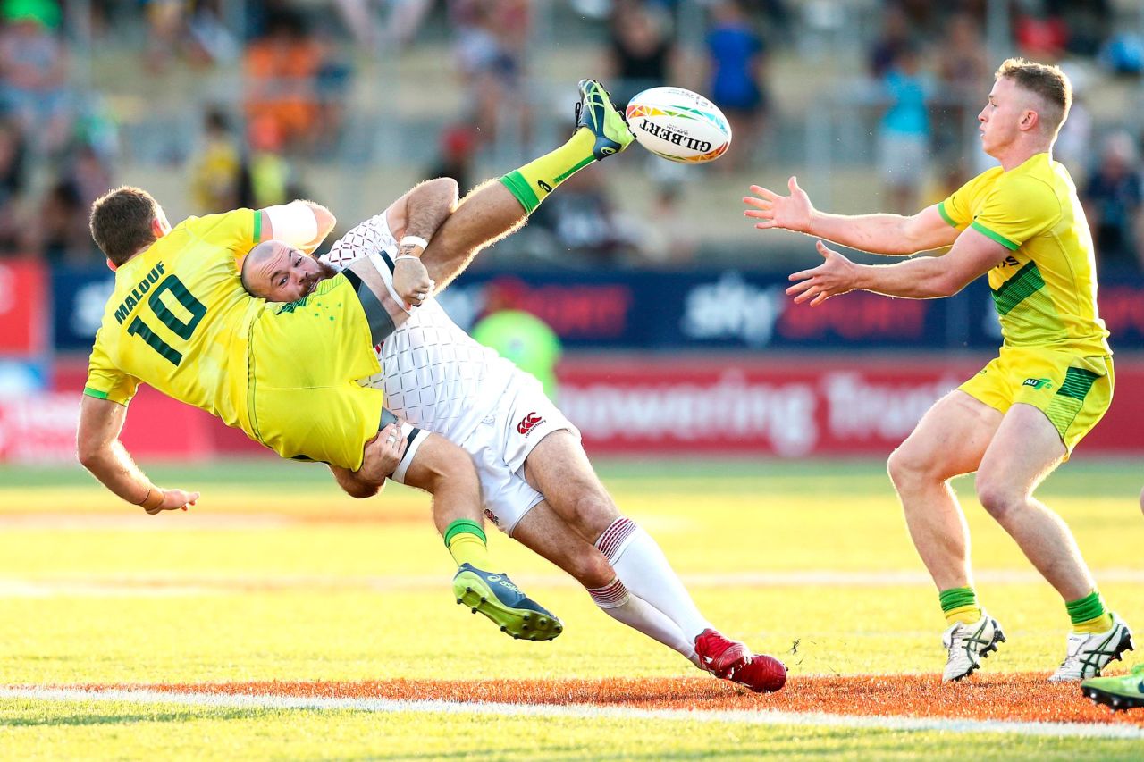 England's Tom Bowen tackles Australia's Nick Malouf during a rugby sevens match in Hamilton, New Zealand, on Sunday, January 26.