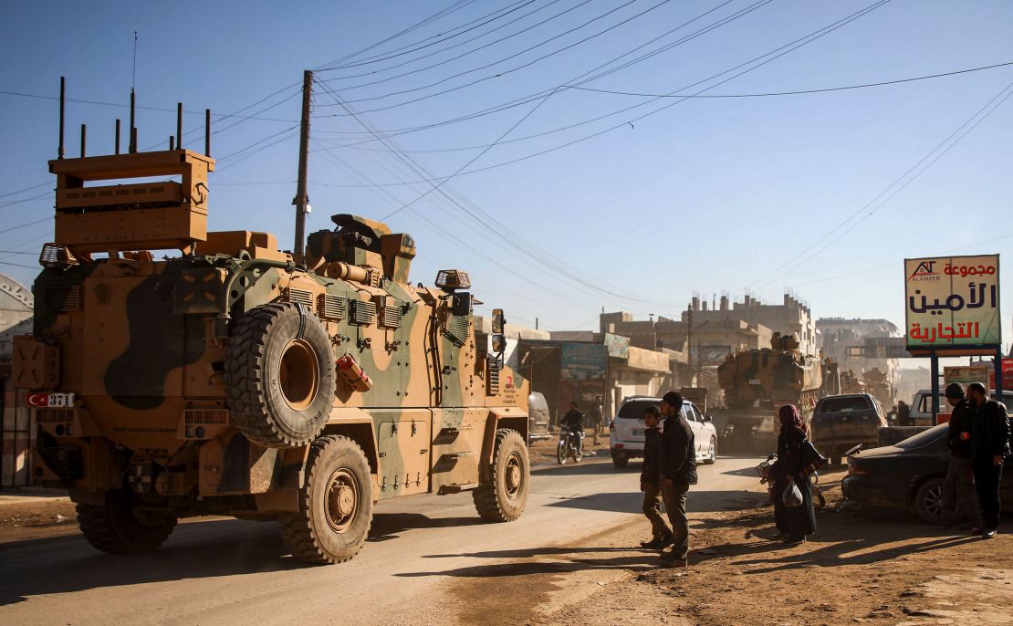 A Turkish military convoy of passes through the Syrian town of Dana on February 2.