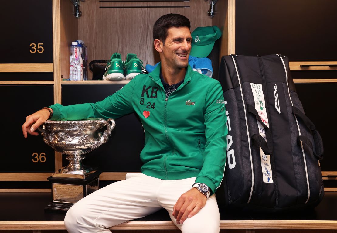 Novak Djokovic poses in the locker room after winning his eighth Australian Open final. 