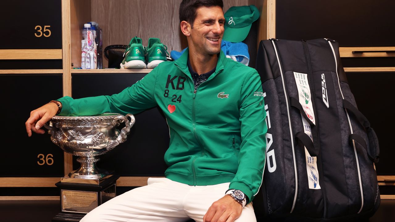 Novak Djokovic poses in the locker room after winning his eighth Australian Open final.