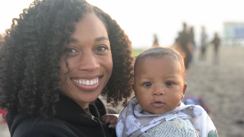 Six-time Olympic gold medalist Allyson Felix holds her daughter Camryn