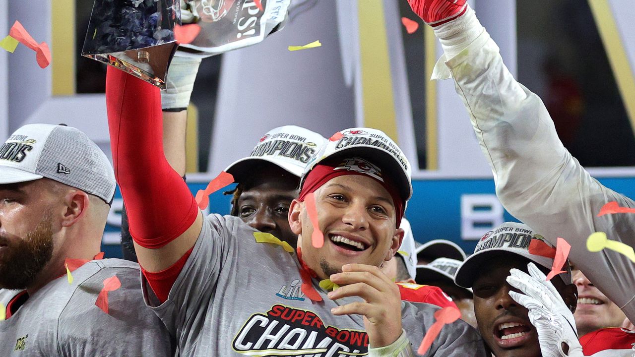 Patrick Mahomes of the Kansas City Chiefs raises the Vince Lombardi Trophy after defeating the San Francisco 49ers in Super Bowl LIV.