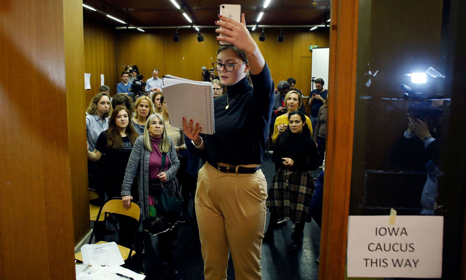 Emily Hagedorn announces results from a satellite caucus location in Paris on February 3. Paris is one of three <a href="index.php?page=&url=https%3A%2F%2Fwww.cnn.com%2Fpolitics%2Flive-news%2Fiowa-caucuses-live-results-coverage-2020%2Fh_345f71228d00f28a514ef40f021dab0a" target="_blank">satellite caucus locations</a> outside the United States.