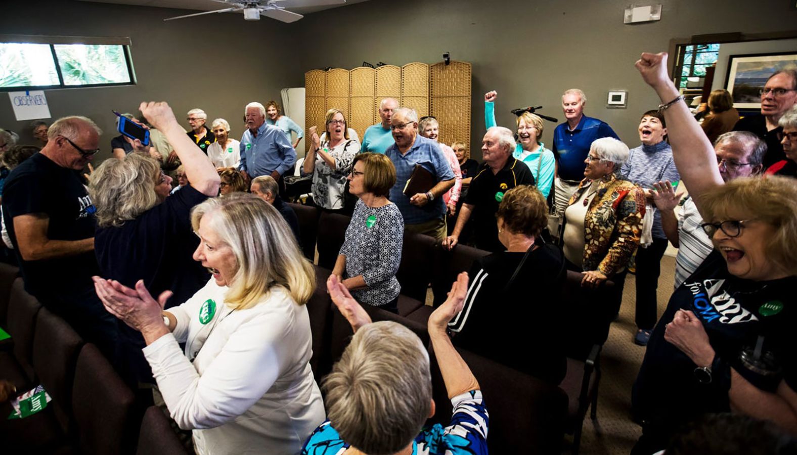 Klobuchar supporters cheer at a satellite caucus location in Port Charlotte, Florida.