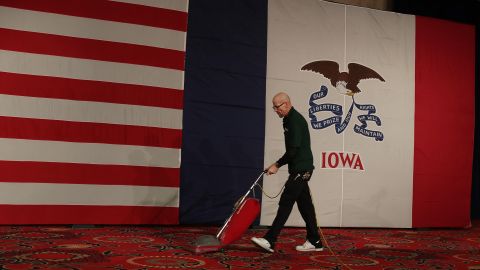 In this February 3, 2020, file photo, Joe Robinson vacuums before the caucus night celebration party for Democratic presidential candidate Sen. Bernie Sanders (I-VT) at the Holiday Inn in Des Moines, Iowa.