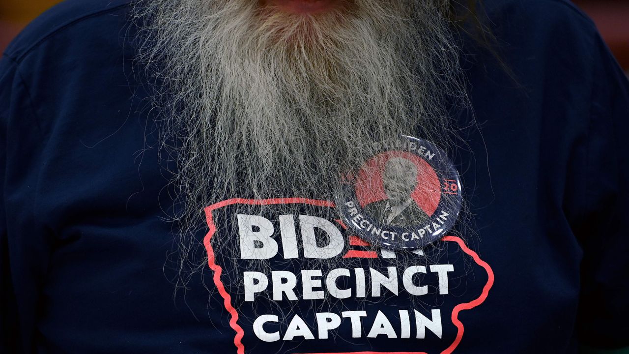 A Precinct Captain for Democratic Presidential candidate former Vice President Joe Biden prepares for the opening of the Iowa Caucus at Lincoln High School in Des Moines, Iowa.