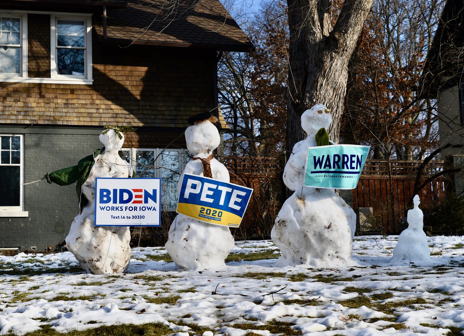 Snowmen in Des Moines are dressed as Biden, Buttigieg and Warren on February 3.