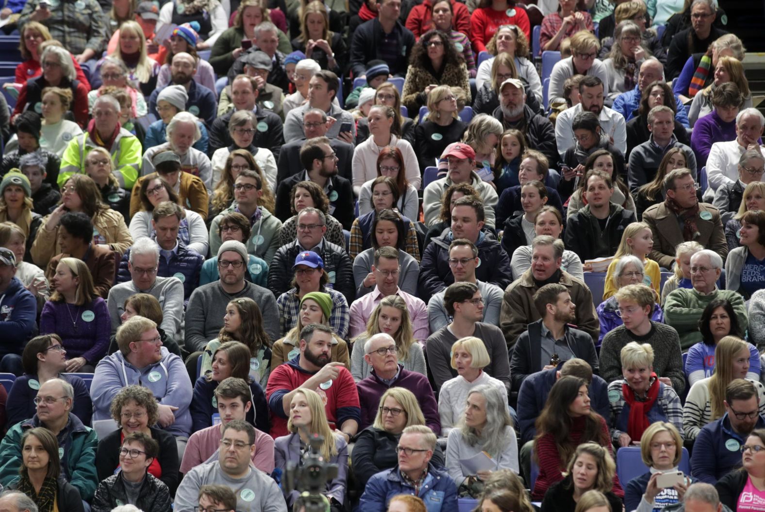 Caucusgoers sit in a Des Moines gymnasium on February 3.