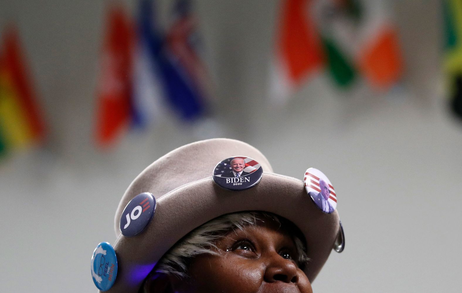 Joann Smith waits in line to attend a caucus-night rally for Biden in Des Moines.